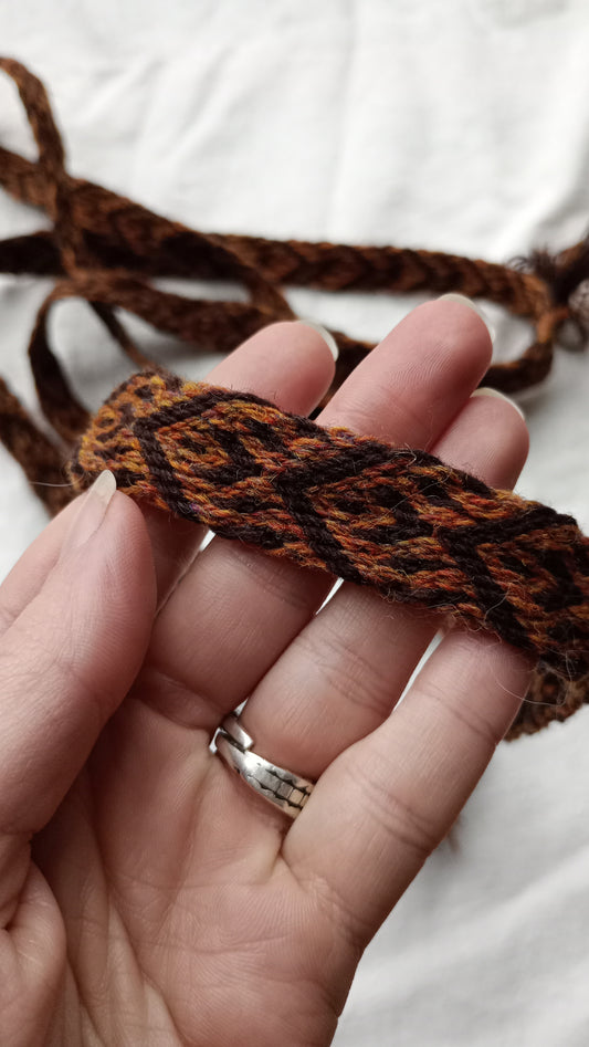 Brown belt with spike and arrow pattern