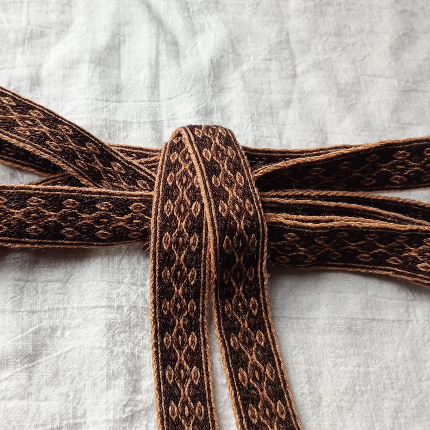 Orange and brown diamond patterned belt