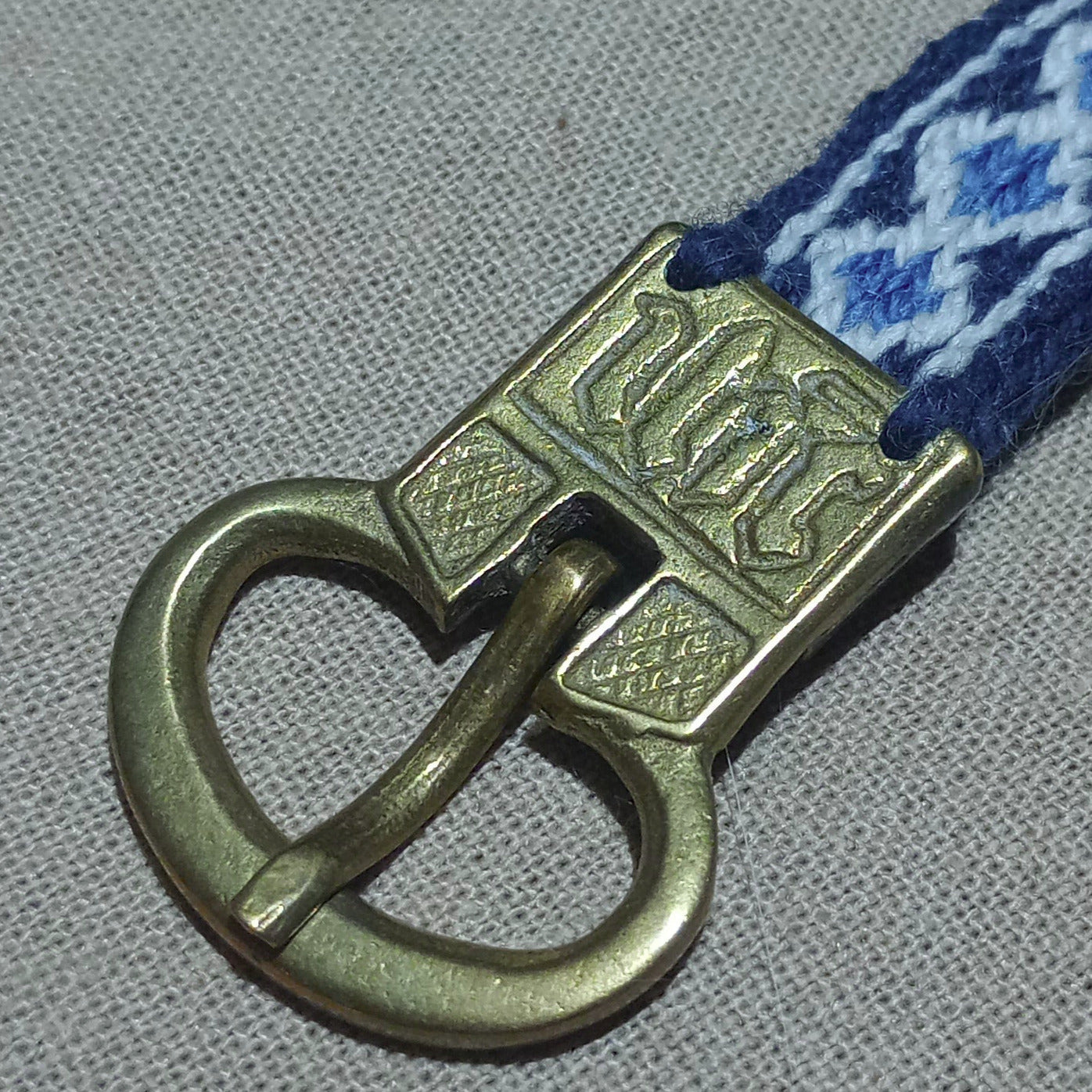 Anglo-Saxon belt from Cambridge. Brass buckle and plant dyed wool