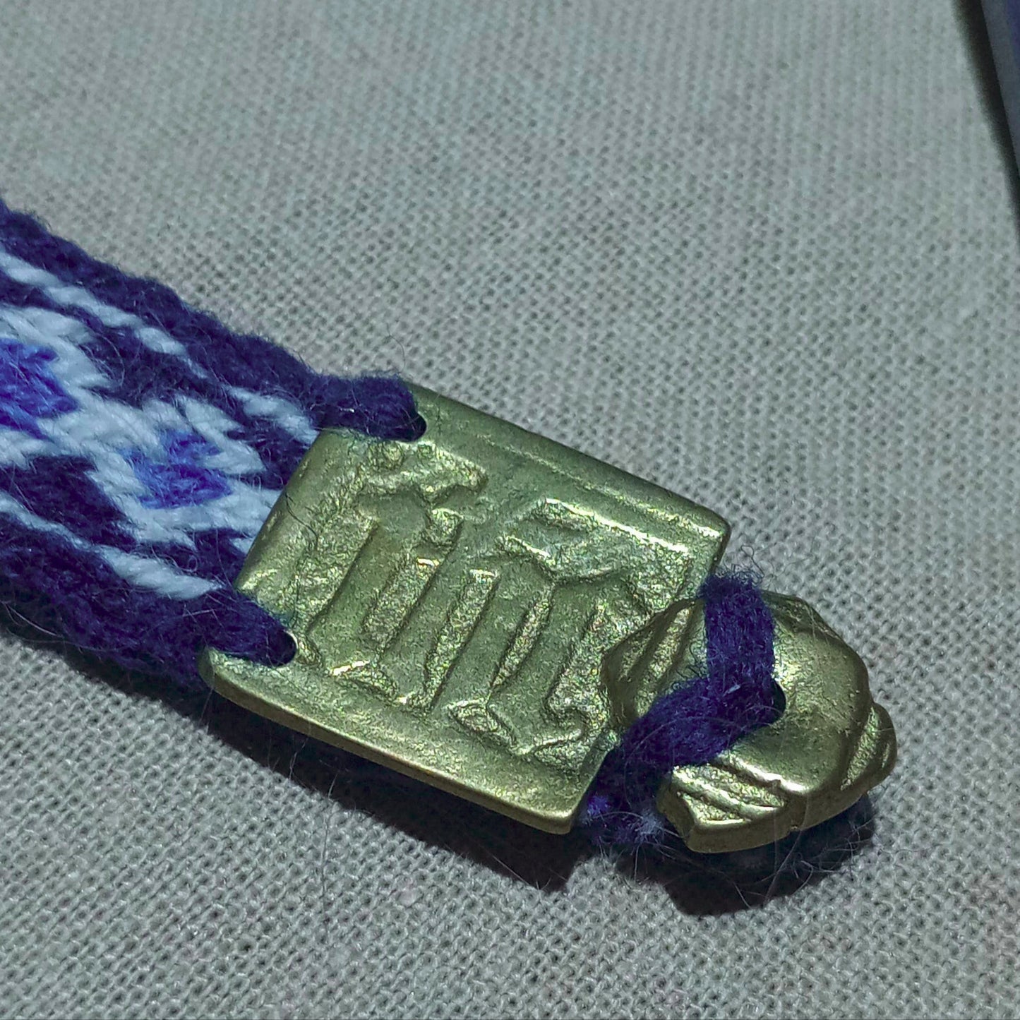 Anglo-Saxon belt from Cambridge. Brass buckle and plant dyed wool