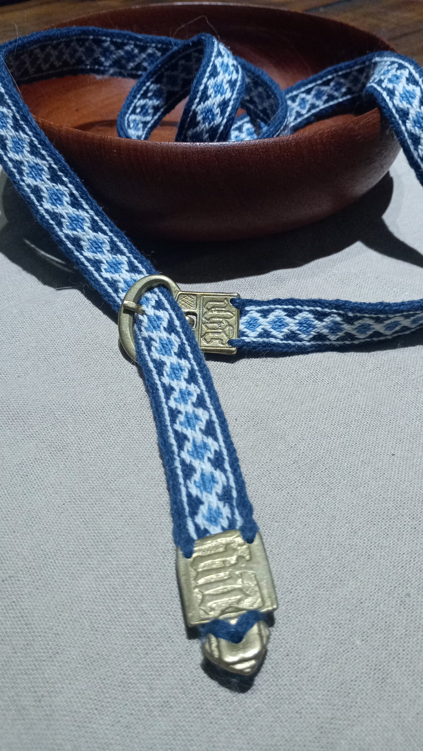 Anglo-Saxon belt from Cambridge. Brass buckle and plant dyed wool