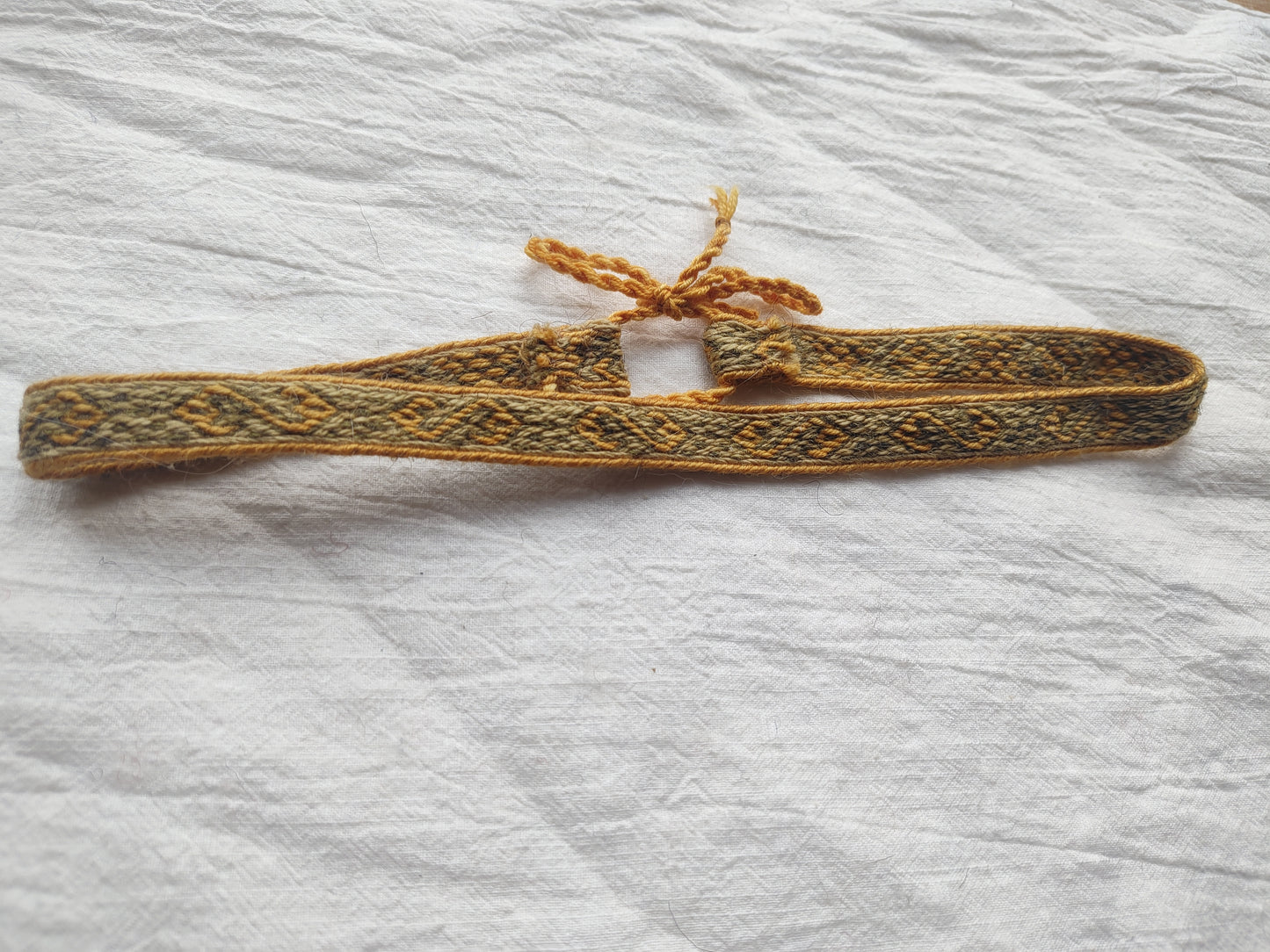 Green adjustable headband with Hallstatt pattern