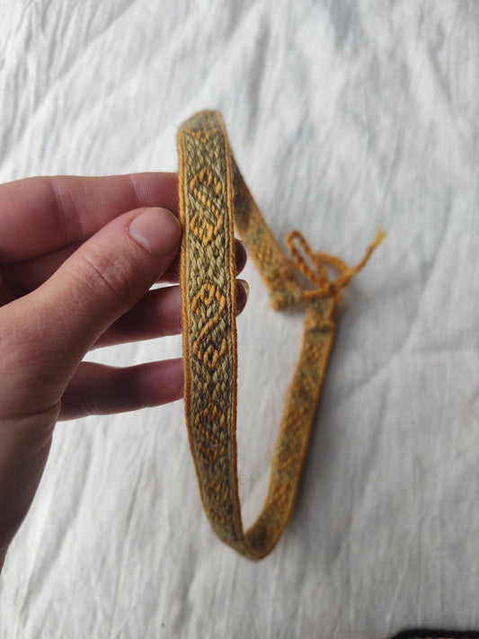 Green adjustable headband with Hallstatt pattern