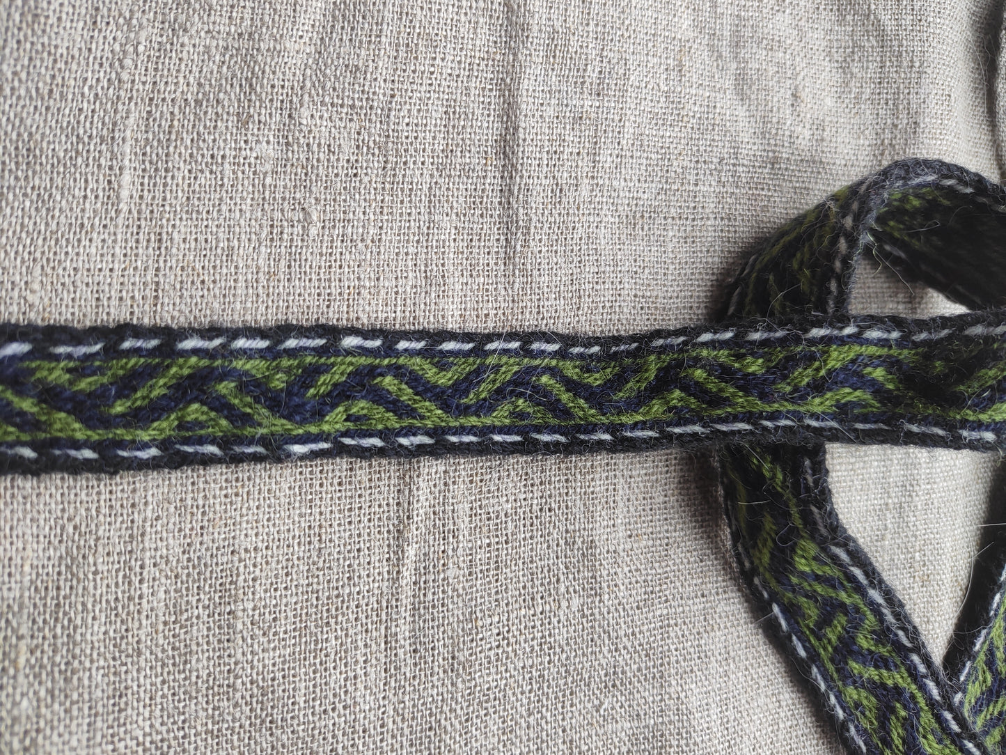 Belt with Finnish Iron Age pattern "tree climbers"
