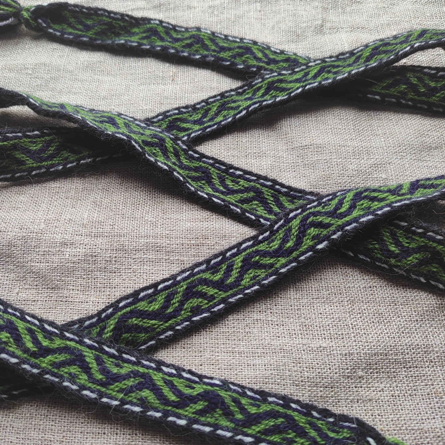 Belt with Finnish Iron Age pattern "tree climbers"