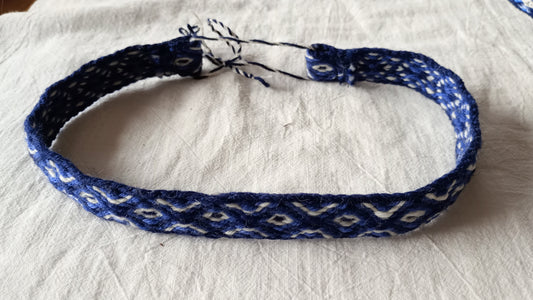 Bright blue headband with white diamond pattern