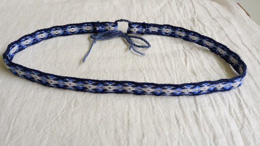 Dark blue headband with diamond pattern
