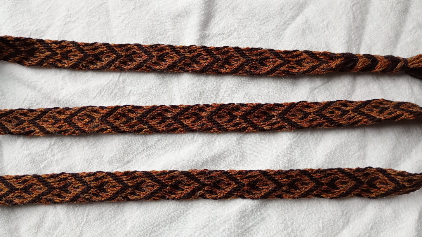 Brown belt with spike and arrow pattern