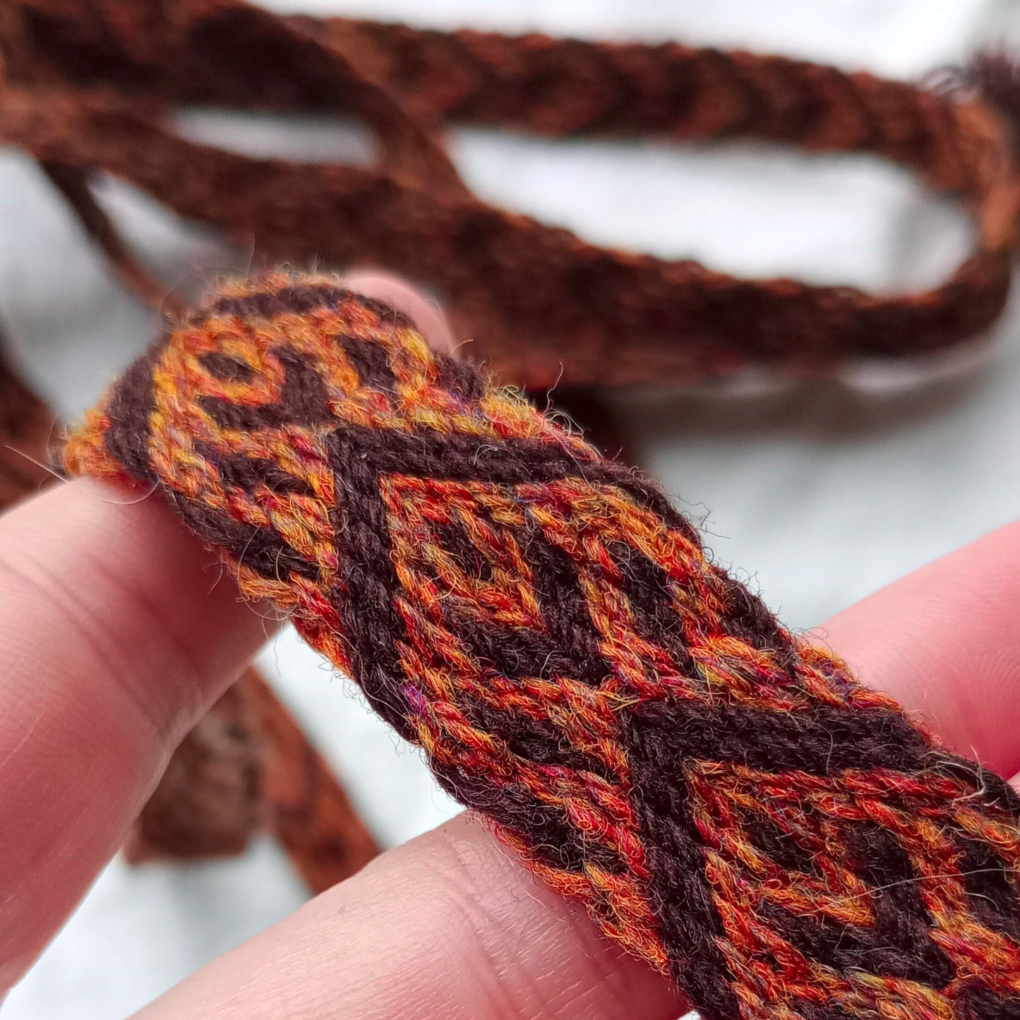 Brown belt with spike and arrow pattern