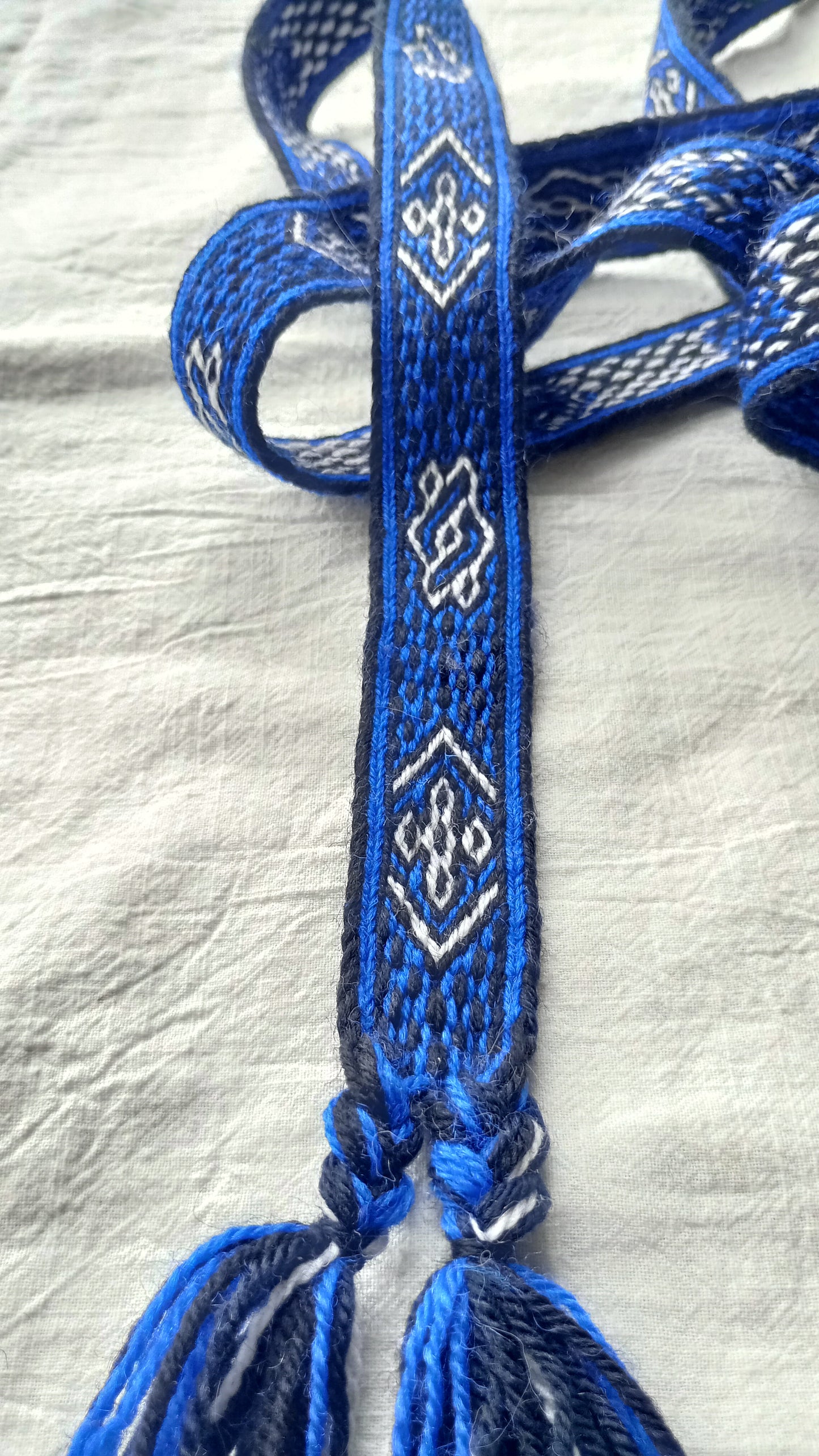 Bright blue belt with white motive