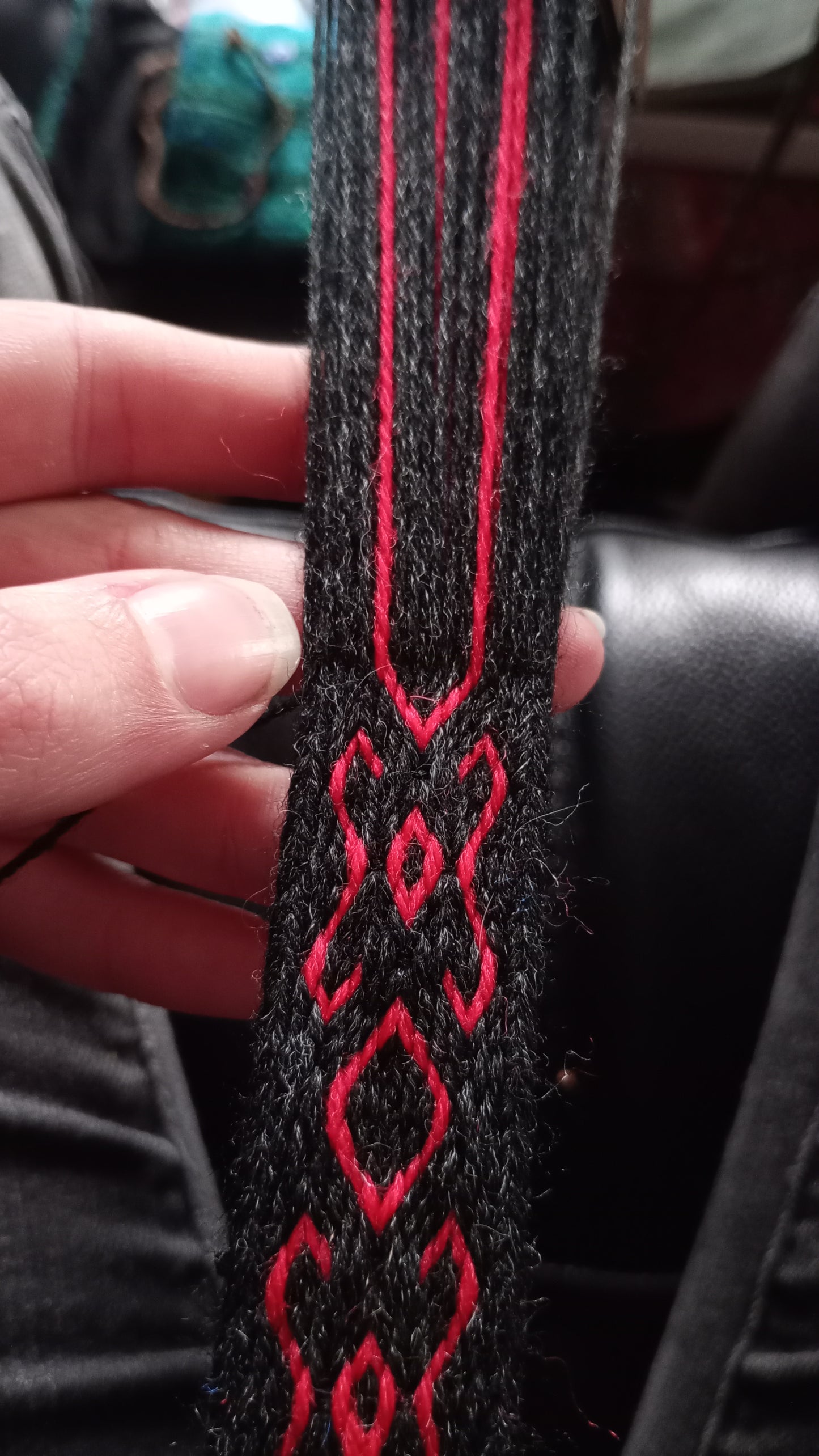 Narrow belt with red pattern