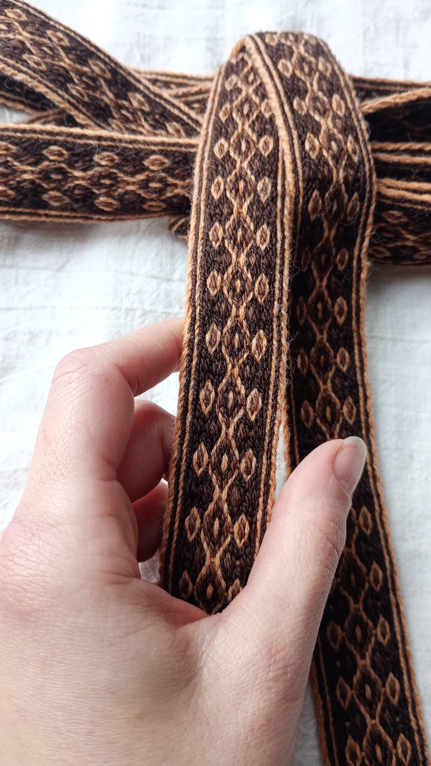 Orange and brown diamond patterned belt