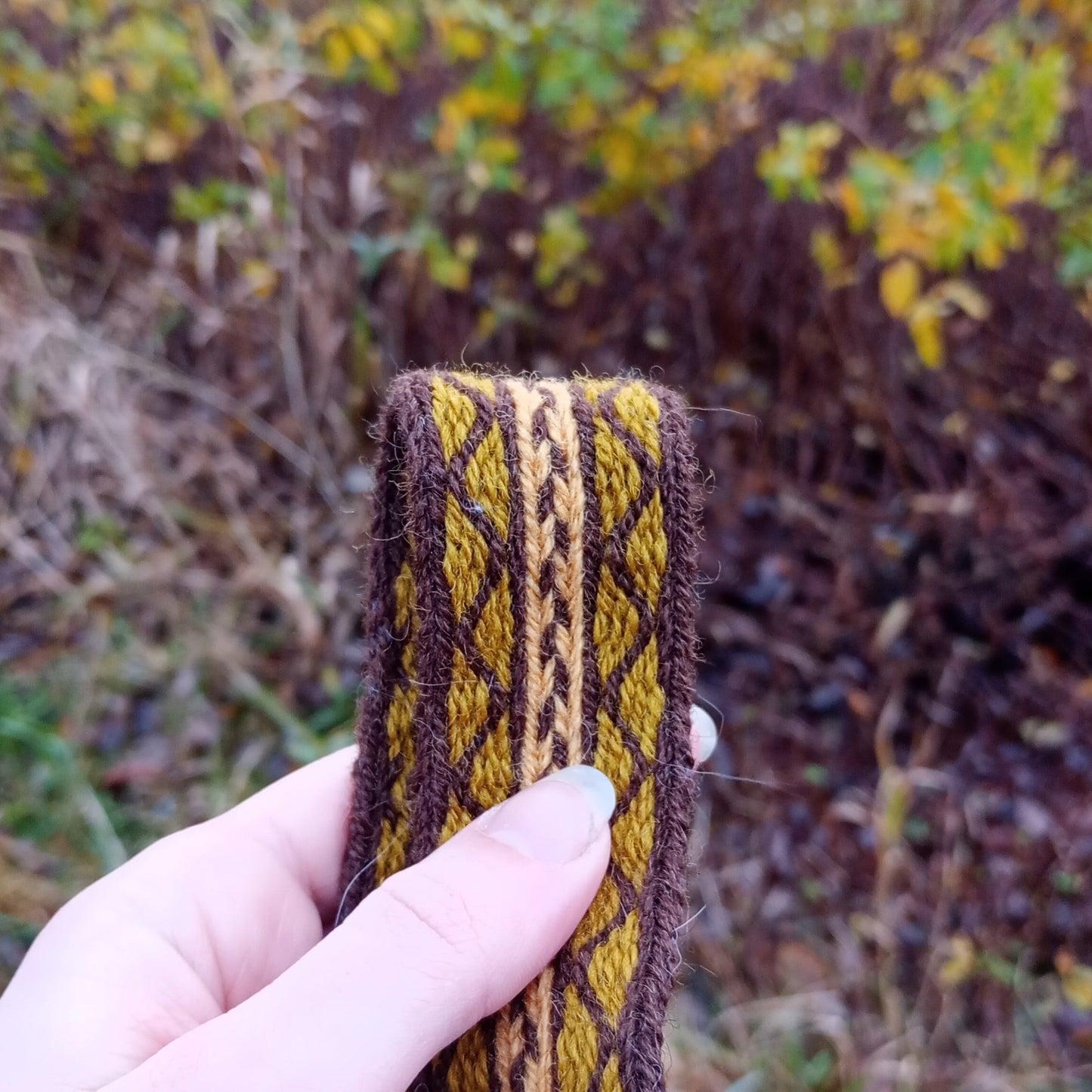 Long autumn coloured belt made of plant dyed yarns