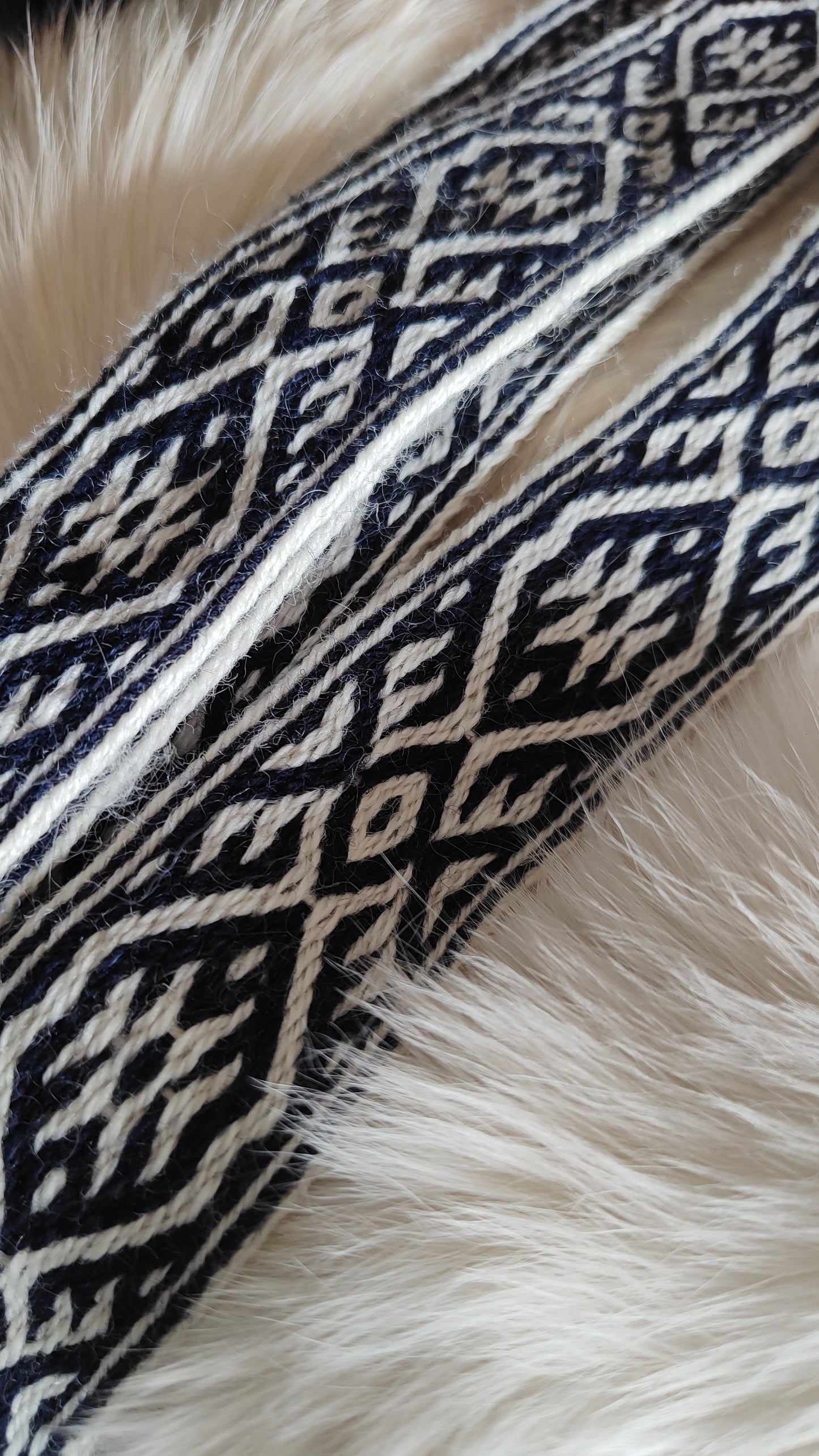 Blue belt with star and key teeth diagonal pattern