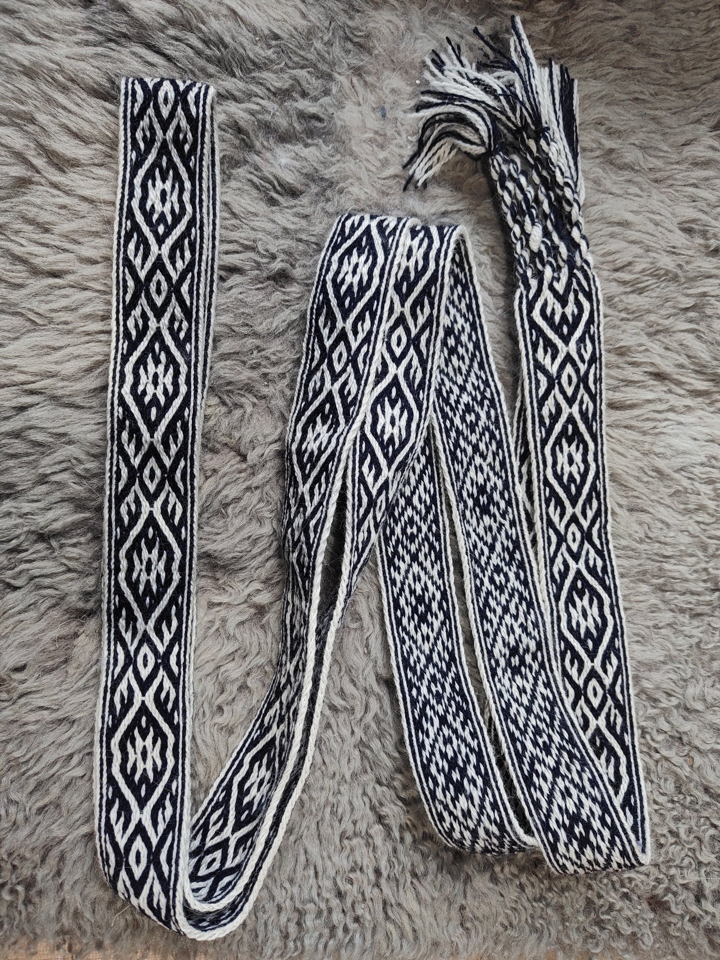Blue belt with star and key teeth diagonal pattern