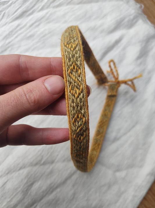 Green adjustable headband with Hallstatt pattern