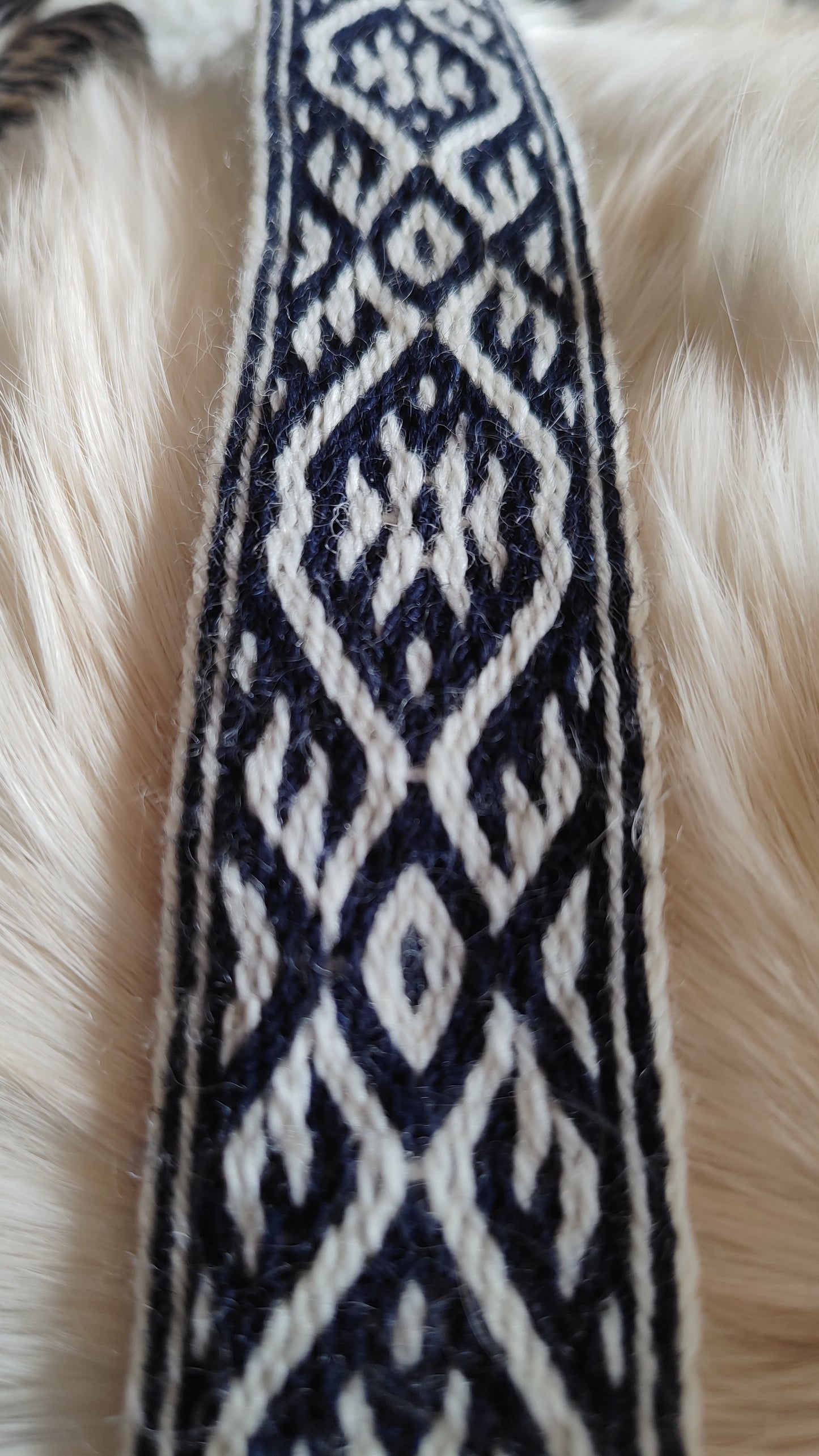 Blue belt with star and key teeth diagonal pattern