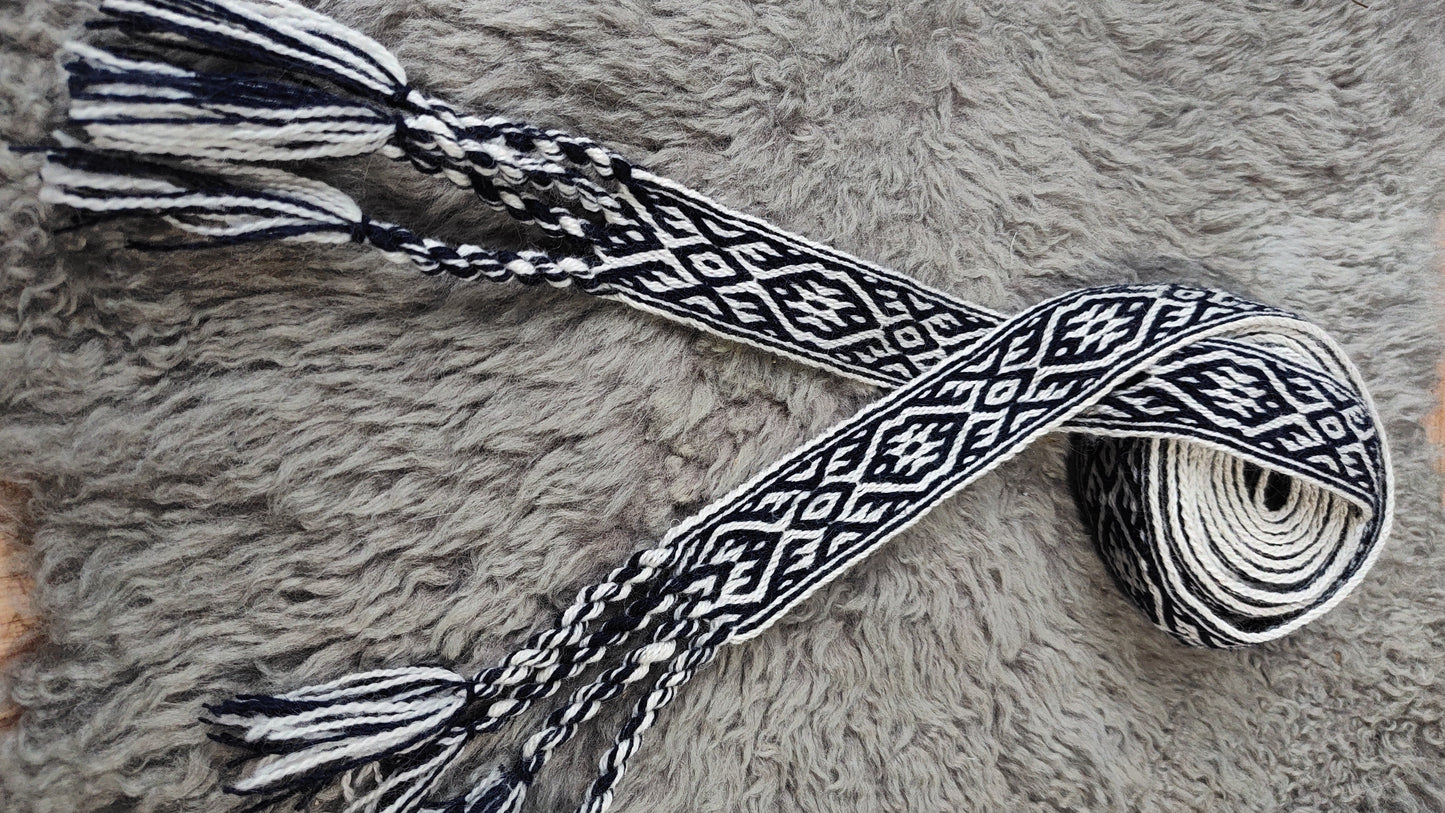 Blue belt with star and key teeth diagonal pattern