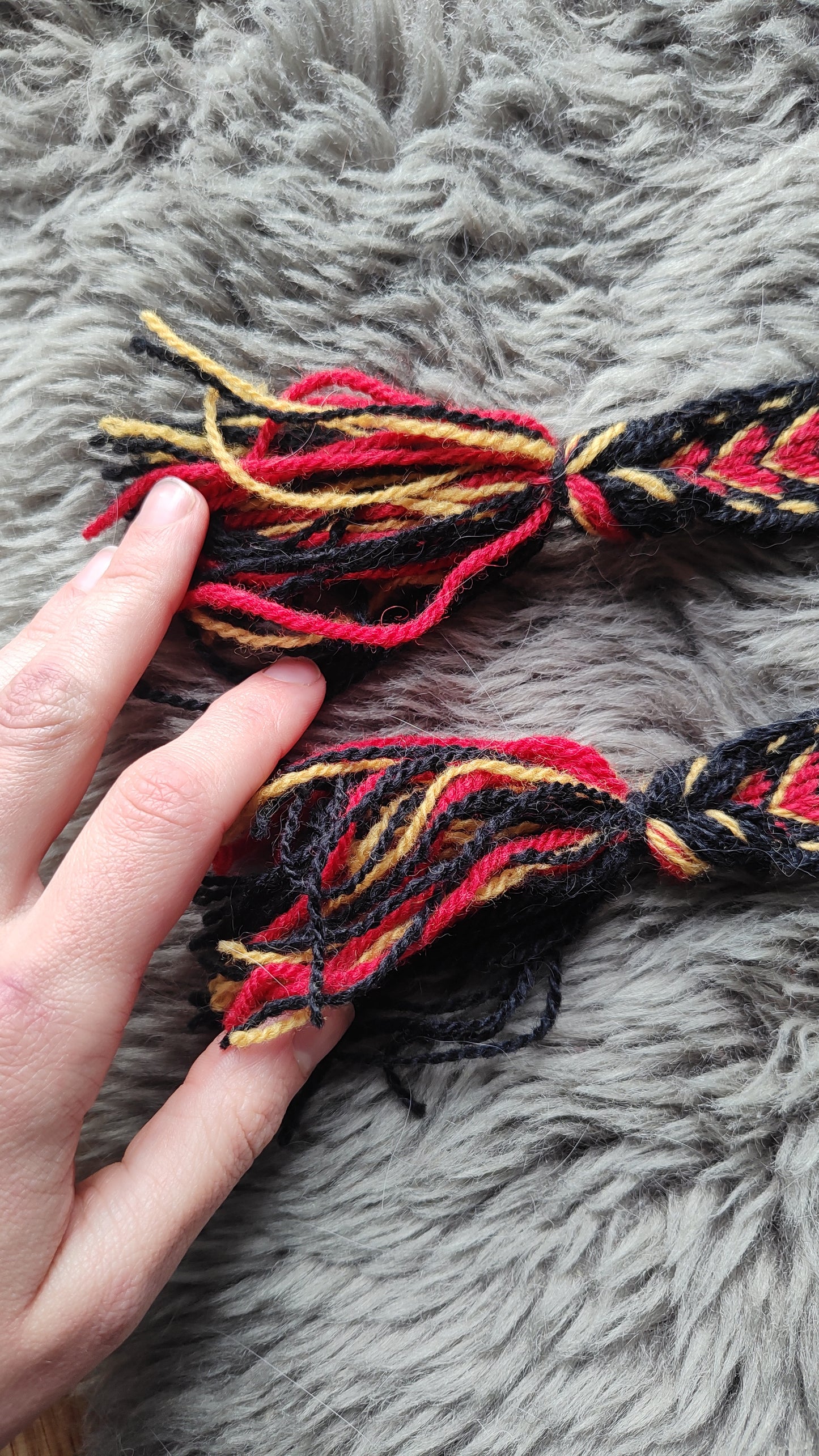 Belt with red arrow pattern