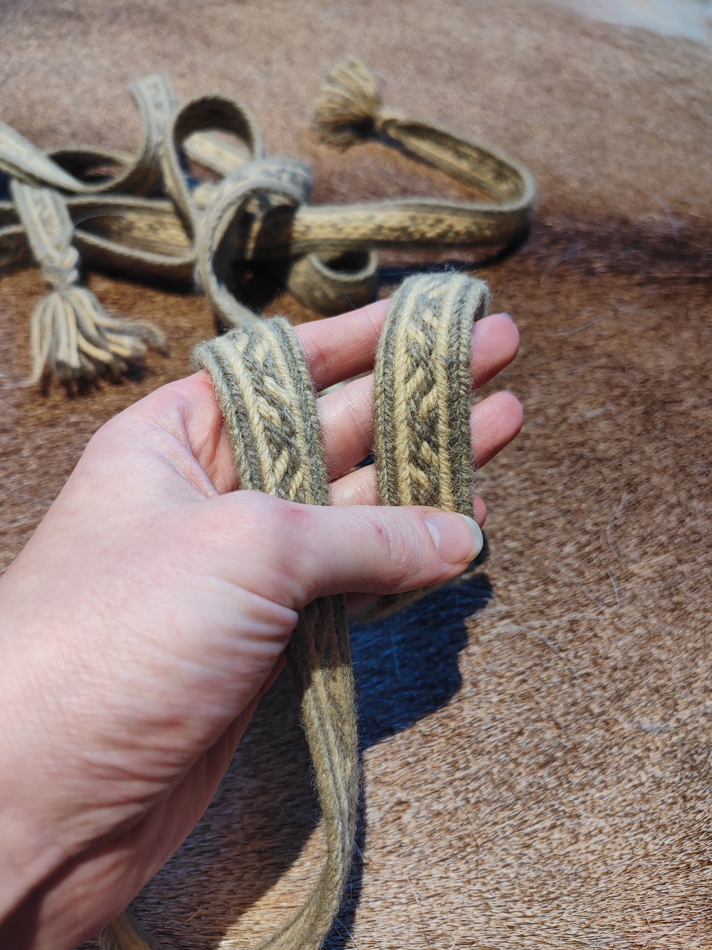 Extra long plant dyed belt with Latvian ∾ pattern