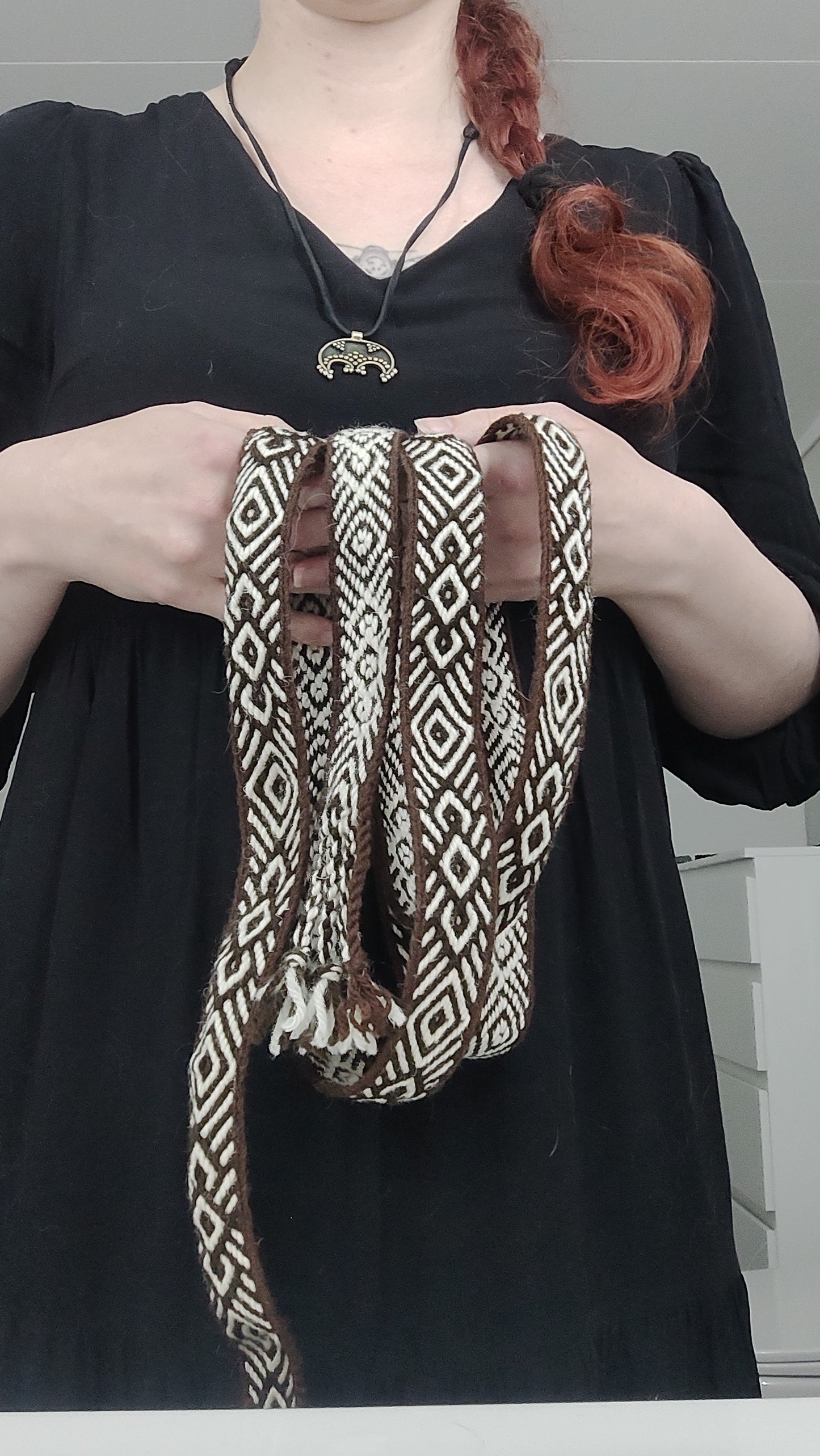 Brown belt with diamond and diagonals pattern