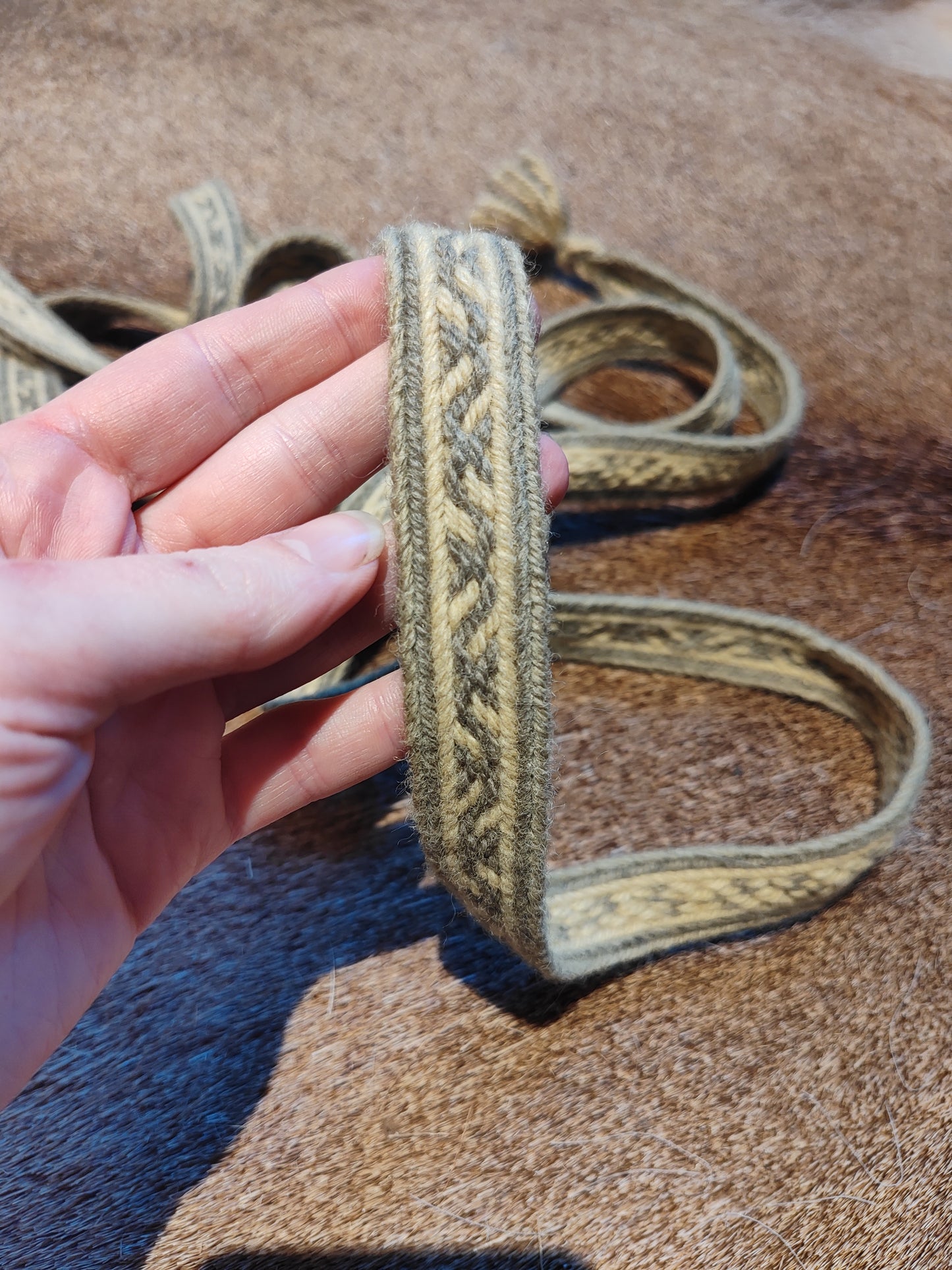 Extra long plant dyed belt with Latvian ∾ pattern