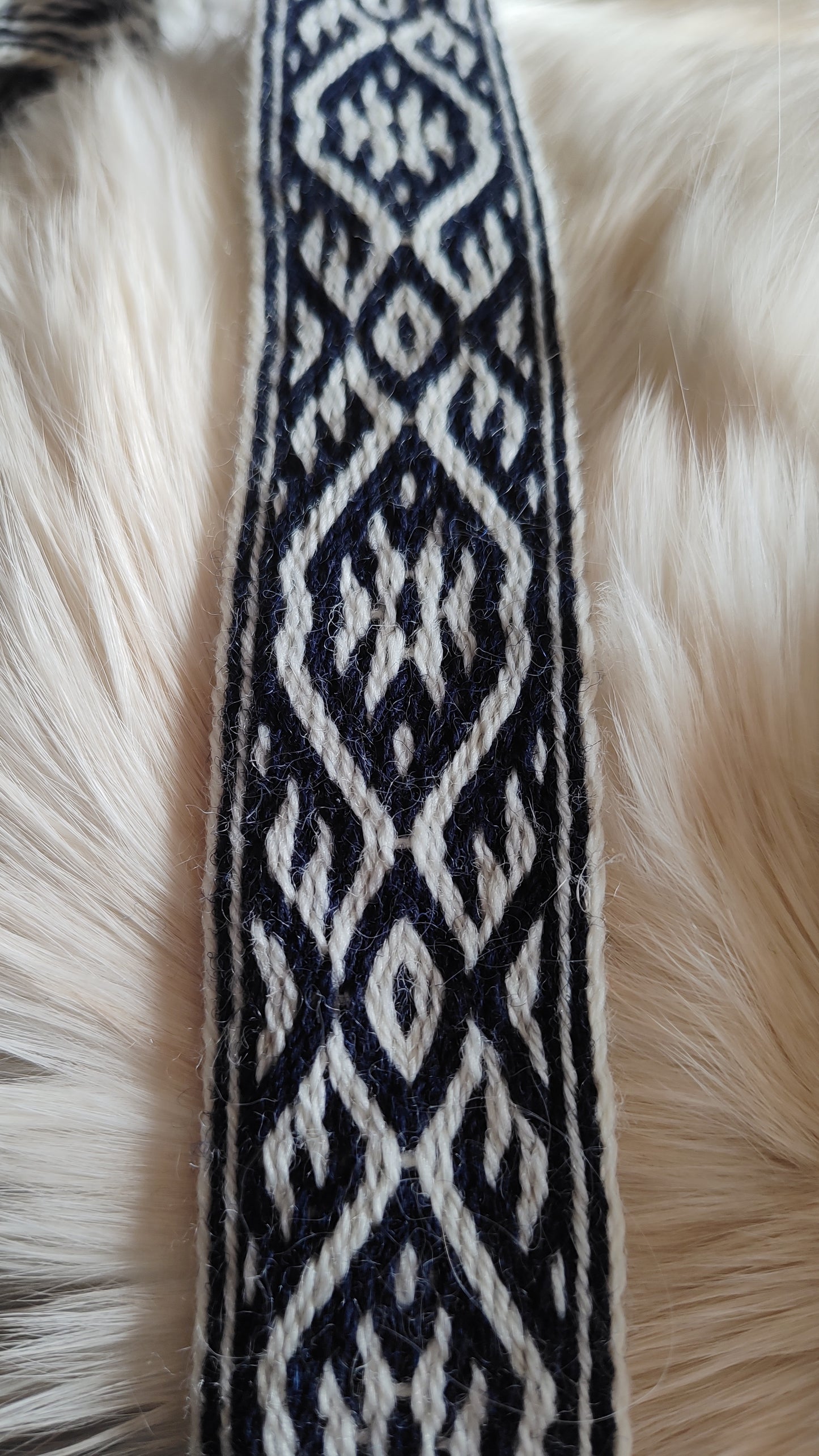 Blue belt with star and key teeth diagonal pattern