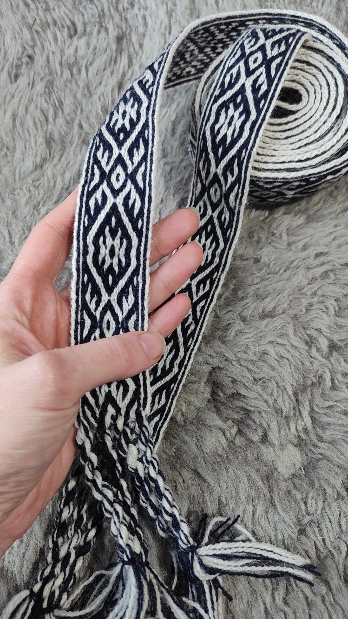 Blue belt with star and key teeth diagonal pattern
