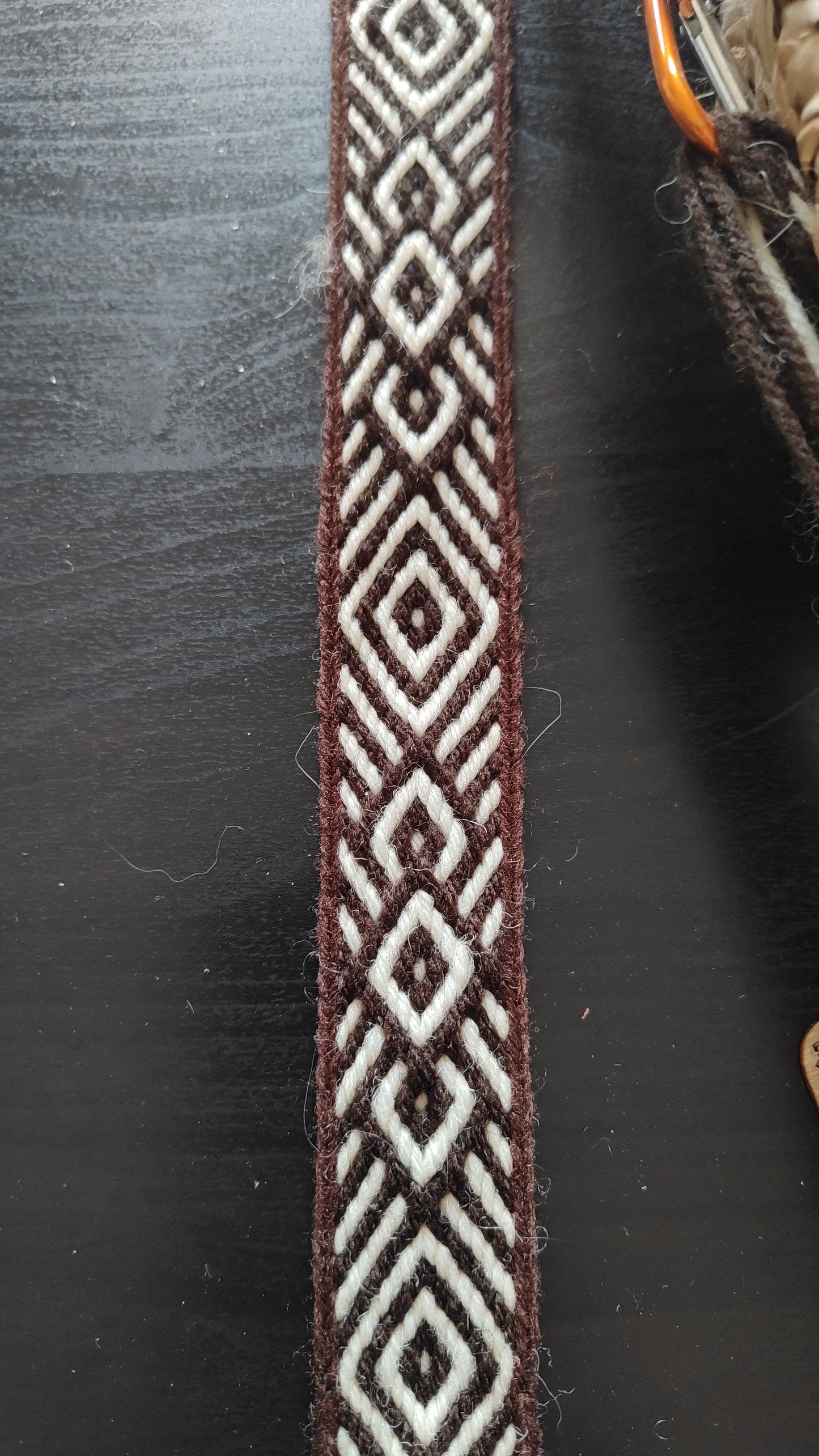 Brown belt with diamond and diagonals pattern
