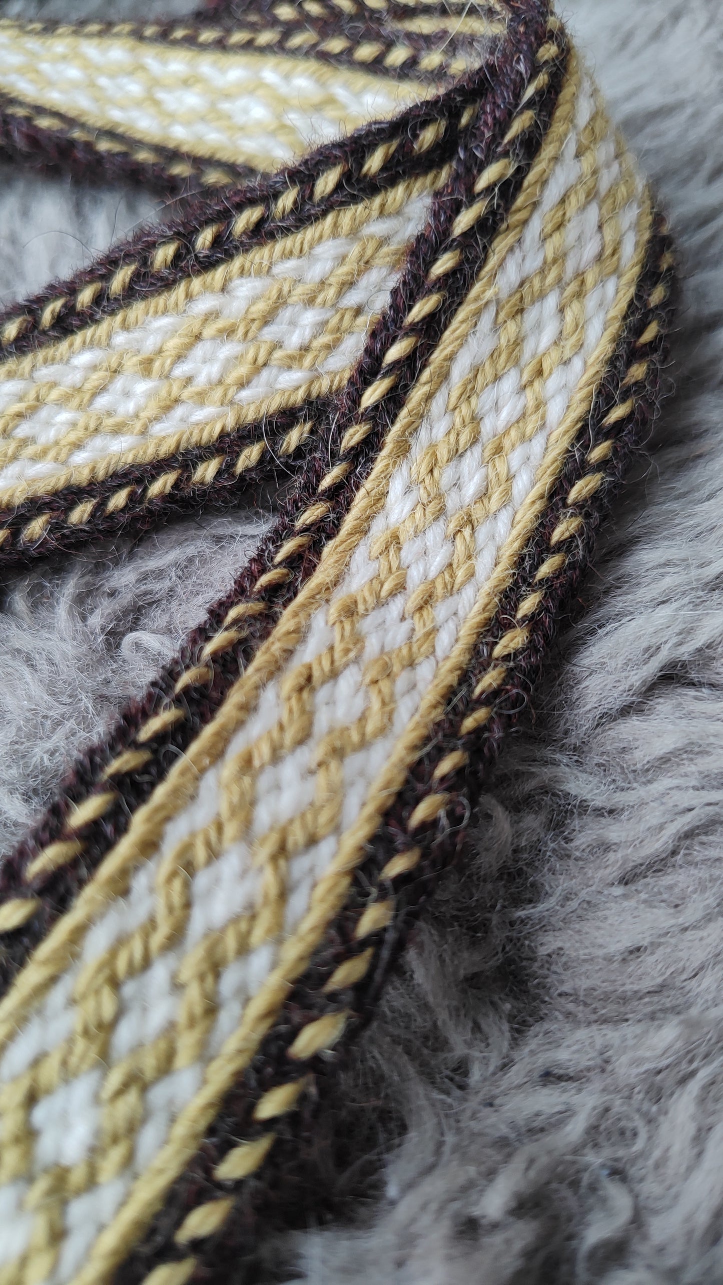 Brown and yellow-green double sided belt in Baltic style