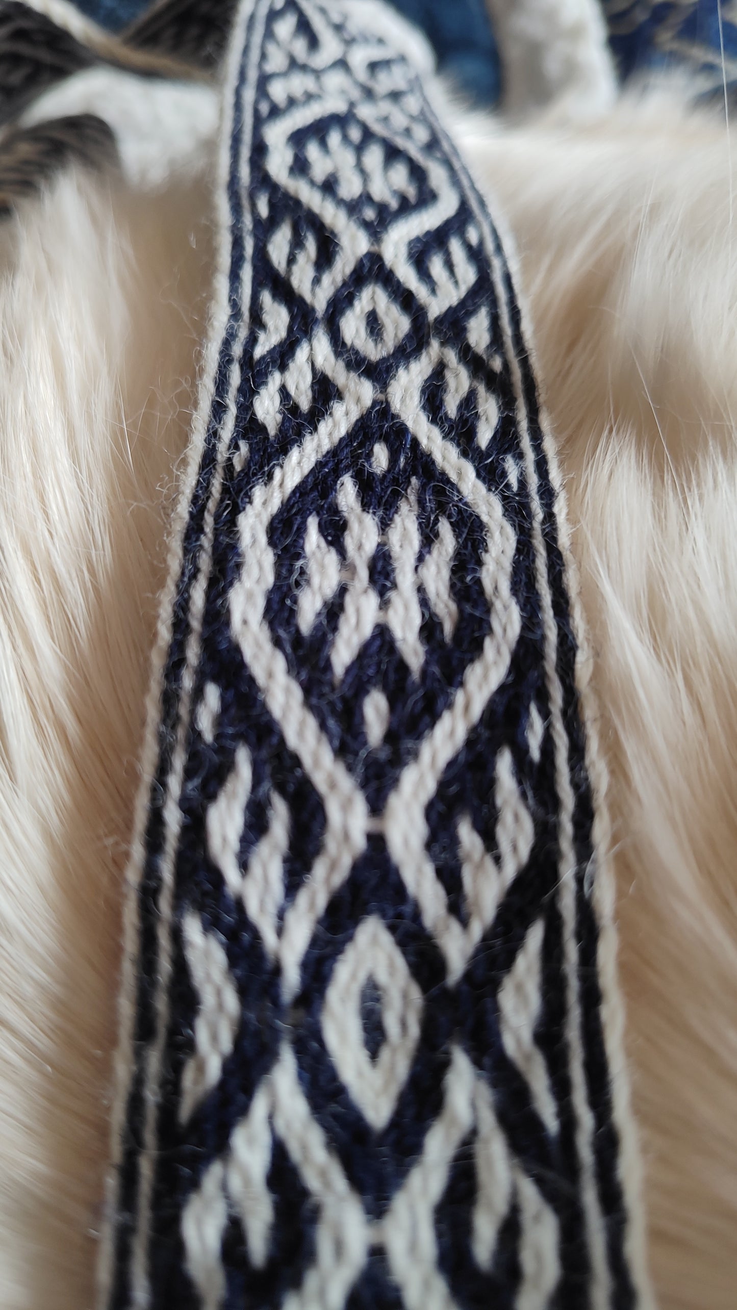 Blue belt with star and key teeth diagonal pattern