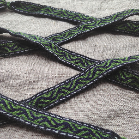 Belt with Finnish Iron Age pattern "tree climbers"