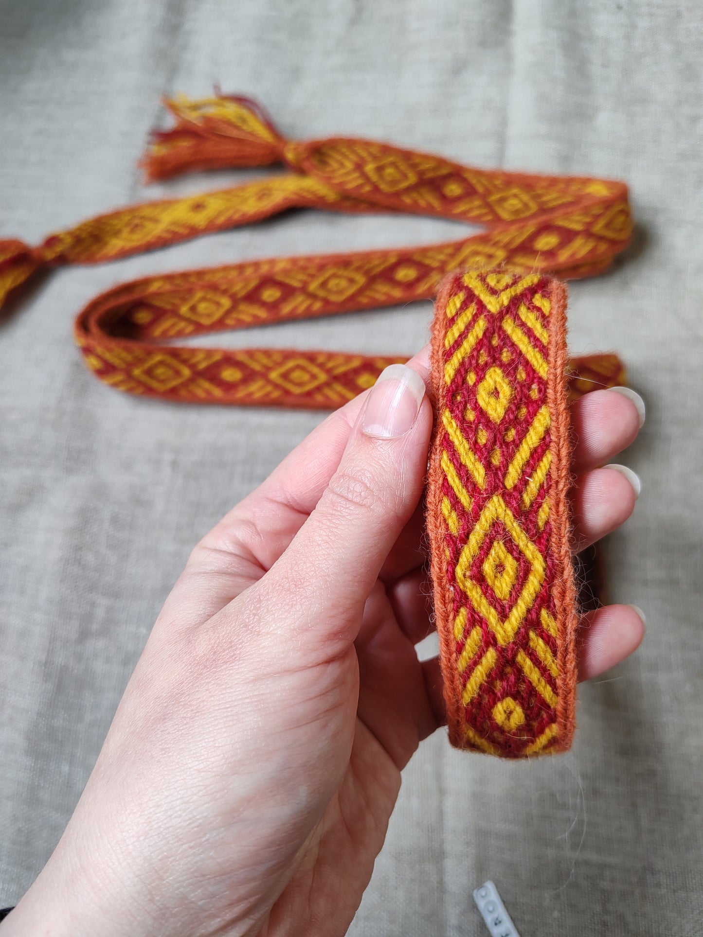 Orange belt with diagonal lines pattern
