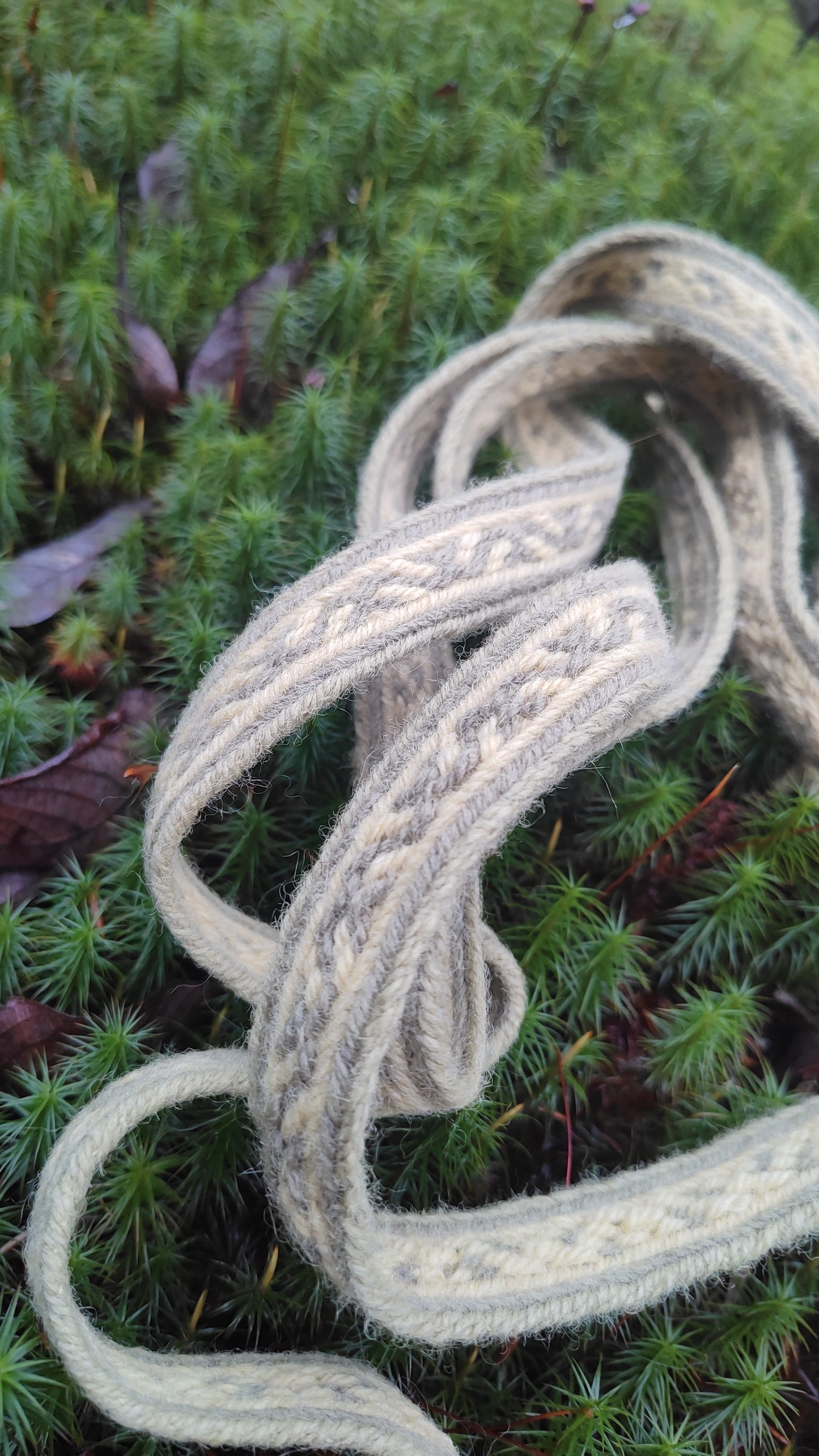 Extra long plant dyed belt with Latvian ∾ pattern