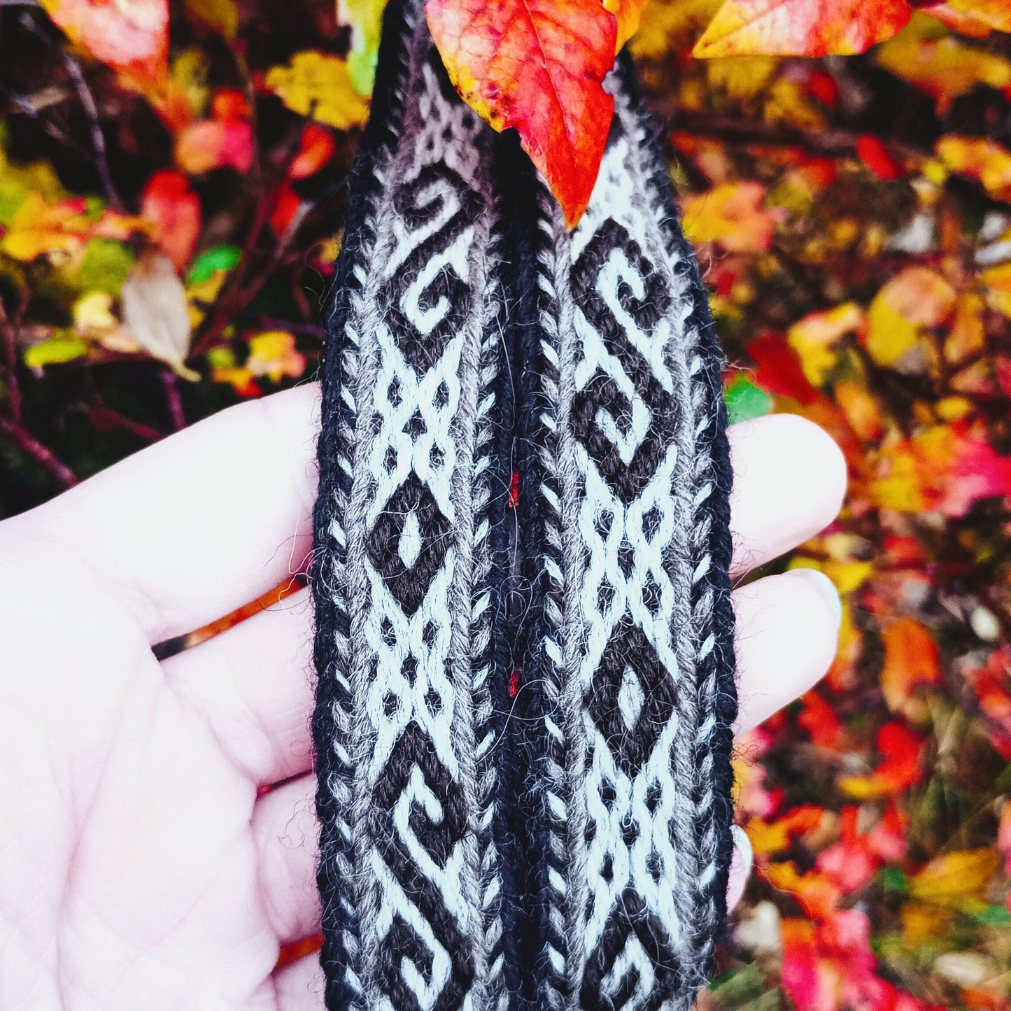 a handwoven belt with spiral and diamond motive