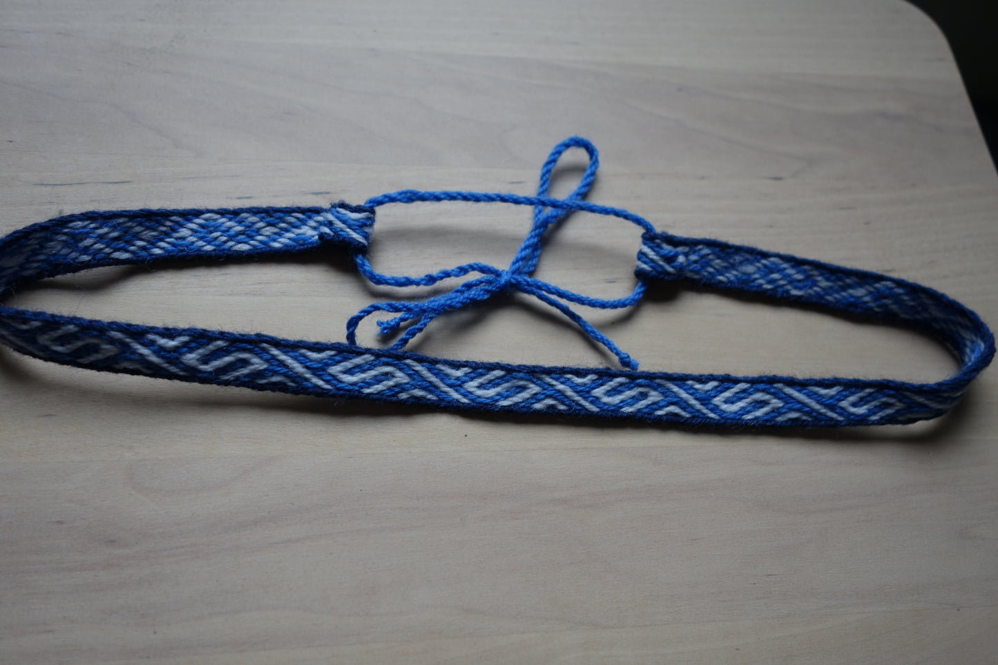 Blue adjustable headband with S Z pattern